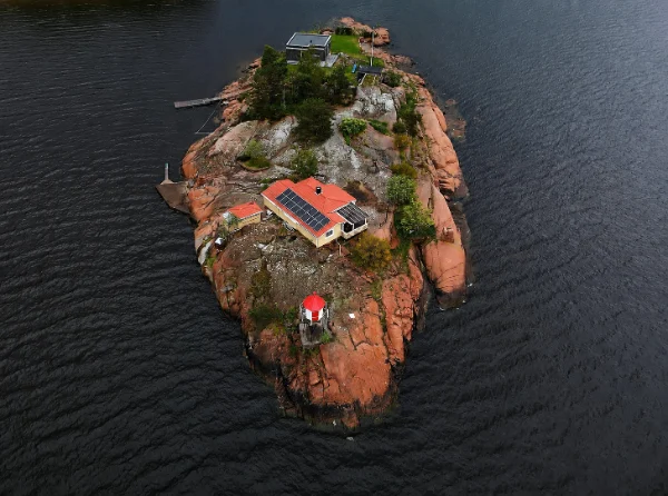 Hybrid island microgrid system with battery energy storage, solar power and intelligent energy management supplying reliable electricity to a remote island community.